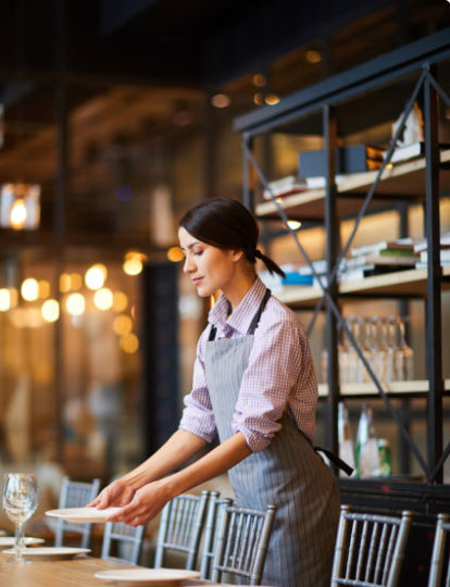 A server setting the table