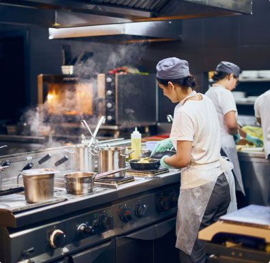 Chefs in the kitchen cooking food