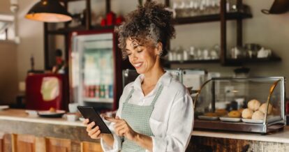 Restaurant server using a mobile tablet.