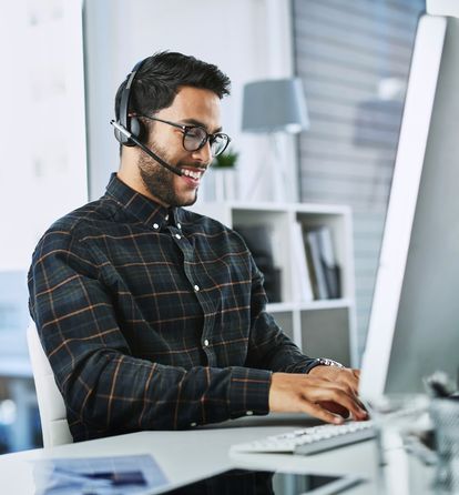 Support technician smiling on the phone