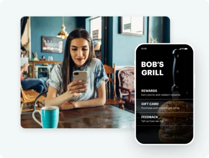 An image of a woman sitting in a restaurant looking at her phone smiling. Screenshot overlay on top of the image with a phone screen app.