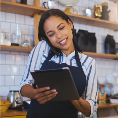 Woman holding an iPad while speaking on the phone