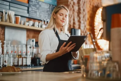 Restaurant employee looking at an ipad